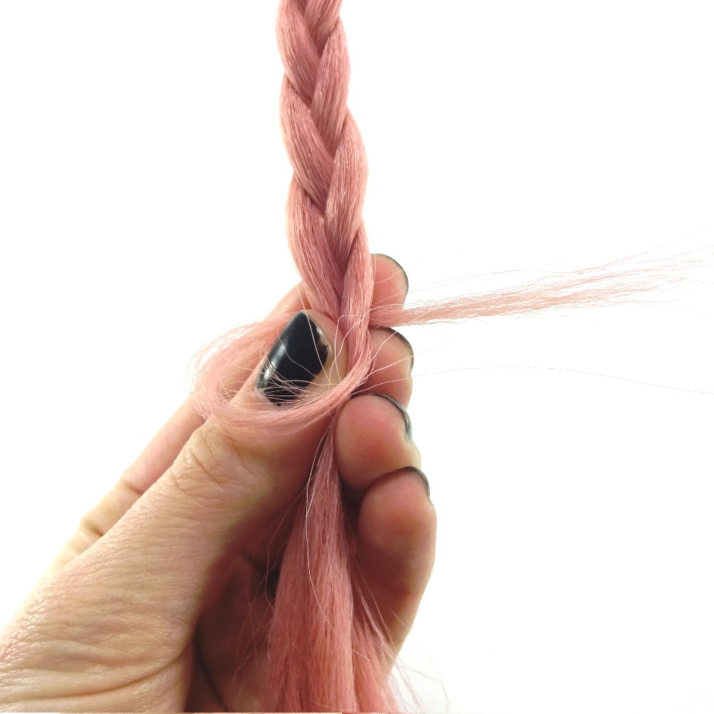 Step 3: Wrap that strand loosely around the end of the braid, then pull the end through the loop you just made.